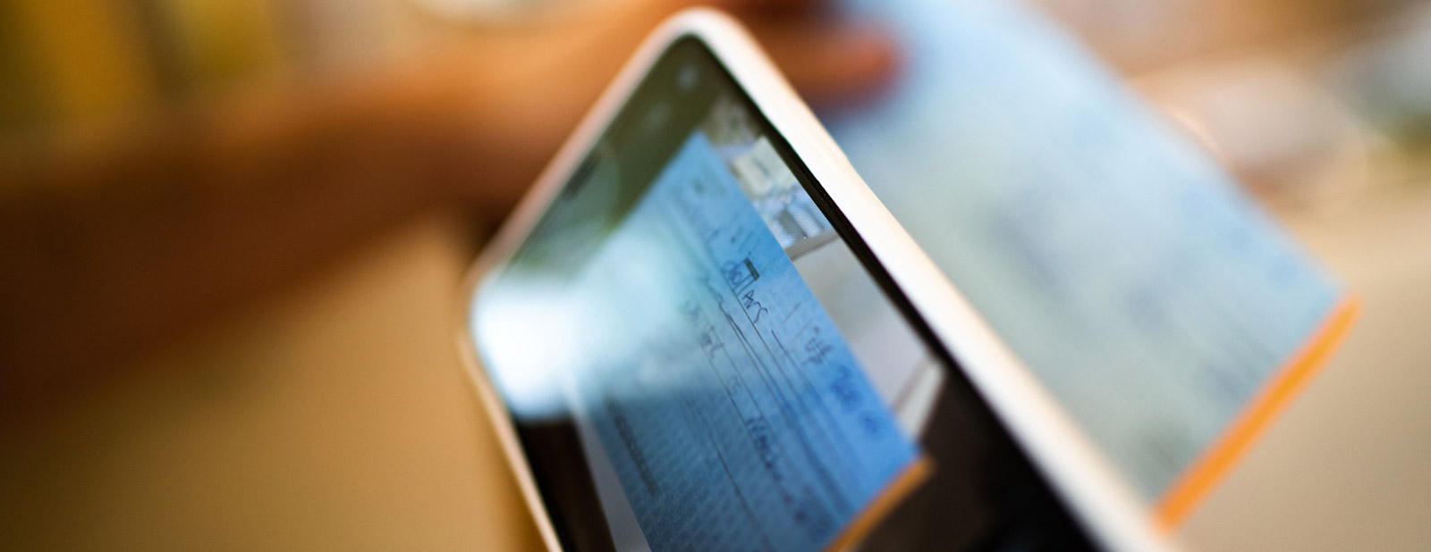 Person scanning their check using their mobile phone app.