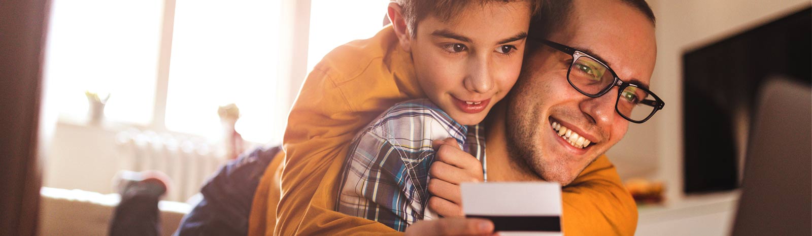 Father and son shopping online.